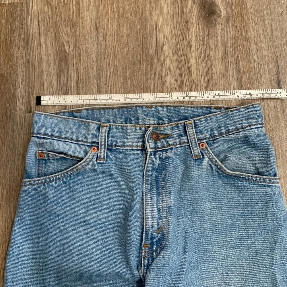 Vintage 80s Levi's 550 orange tab tapered leg denim jeans in light wash - 30x30‎